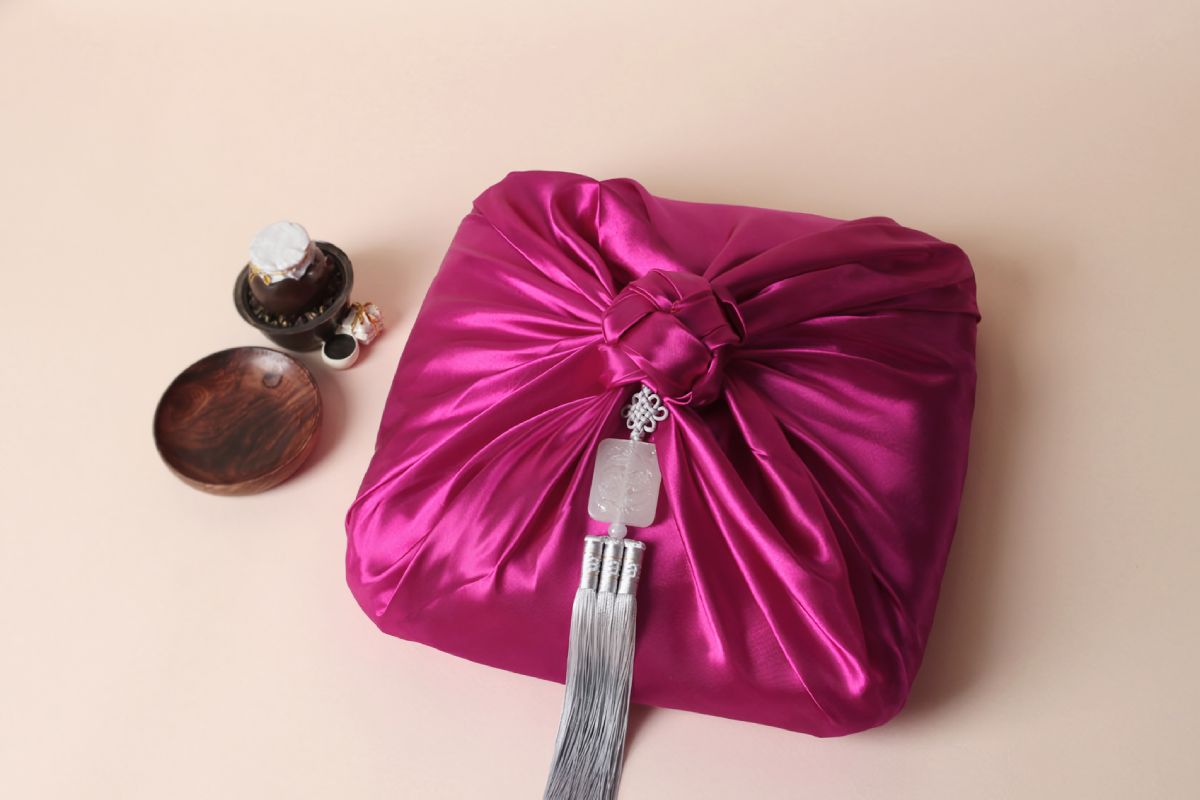 a box wrapped with azalea color Bojagi.